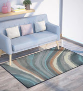 Machine washable rug with soft brown and cream wave patterns.